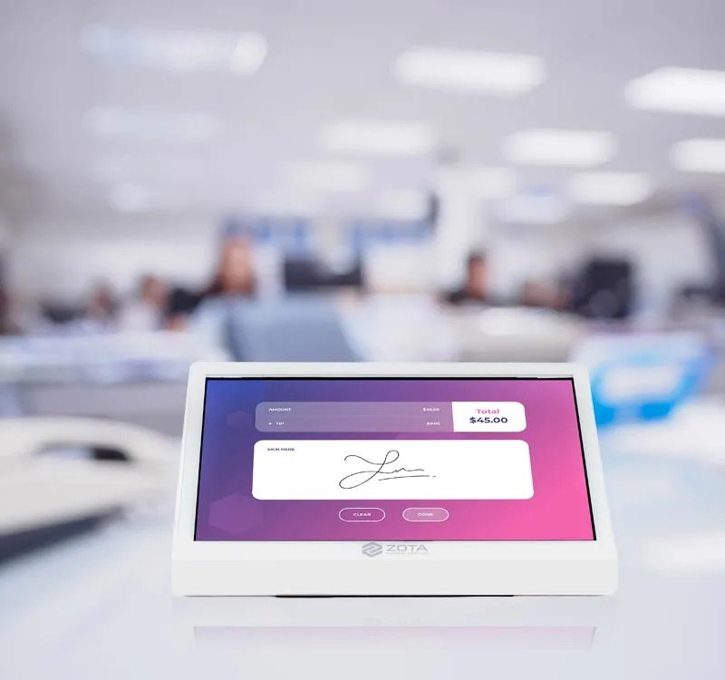 Zota check-in/check-out service featuring an e-signature tablet for seamless customer check-out.
